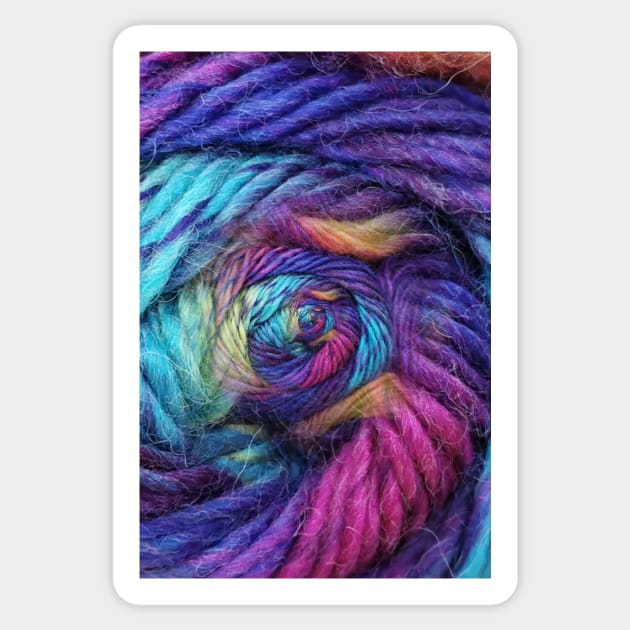 ball of coloured wool making a complex design structure on black background Sticker by mister-john